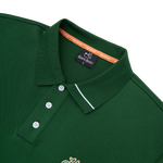 Green polo shirt with brand logo on a white background