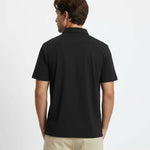 Man wearing a black polo shirt on a white background